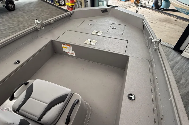 Slide: The Image of 2020 Alumacraft 20 Bay boat interior with seating and storage compartments. - 32