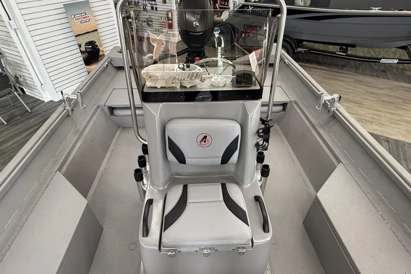 Slide: The Image of 2020 Alumacraft 20 Bay boat interior with console and seating in showroom. - 34