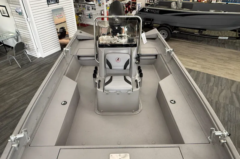 Slide: The Image of 2020 Alumacraft 20 Bay boat interior with central console and seating in showroom. - 39
