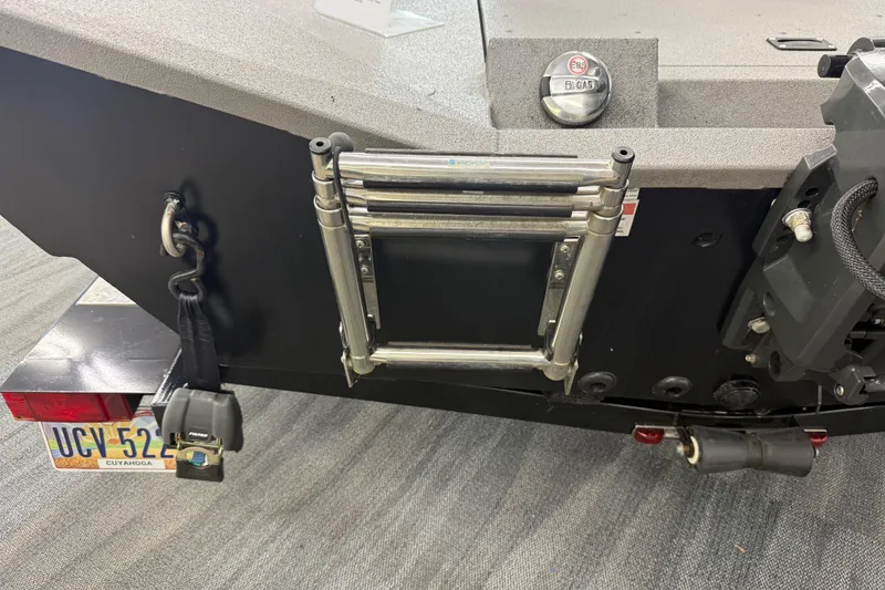 Slide: The Image of 2020 Alumacraft 20 Bay boat rear view with ladder and license plate. - 42