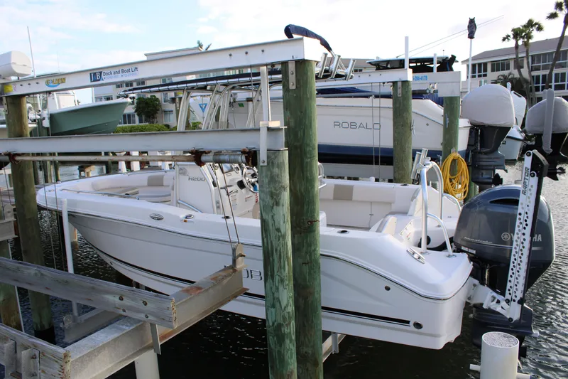 Slide: The Image of 2017 Robalo R200 Center Console boat on a lift at a marina. - 17