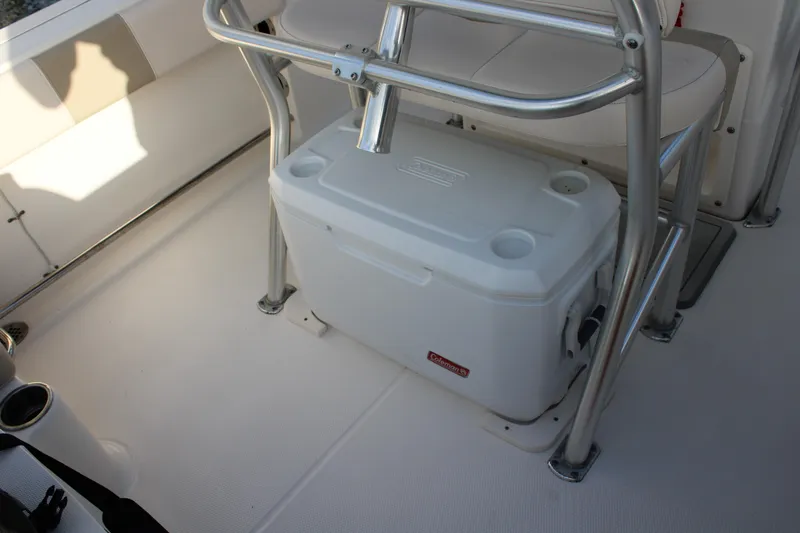 Slide: The Image of 2017 Robalo R200 Center Console boat interior with cooler under seat. - 21