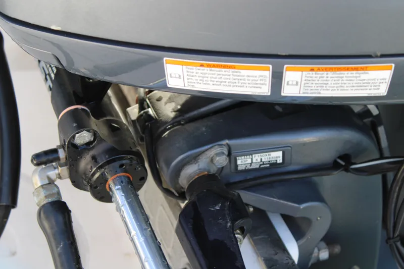 Slide: The Image of Close-up of a 2017 Robalo R200 Center Console boat engine components. - 24