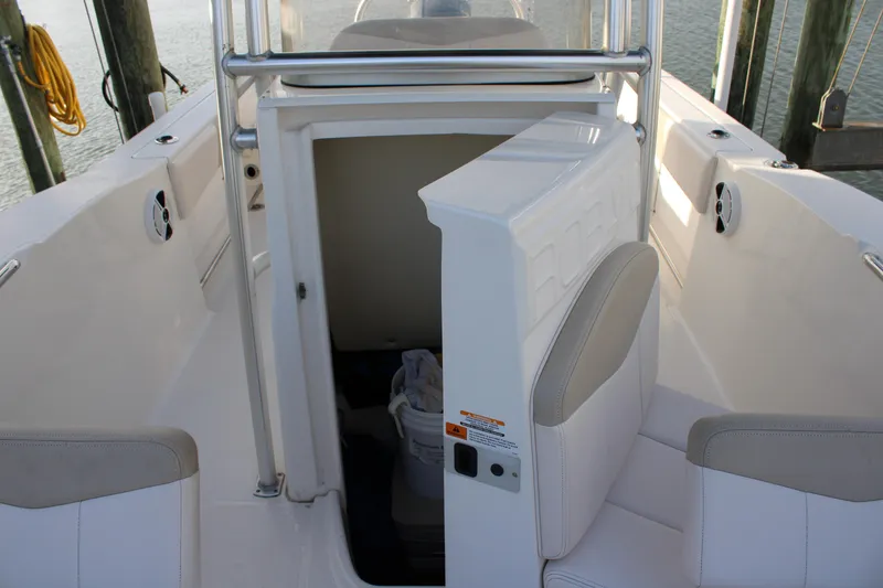Slide: The Image of 2017 Robalo R200 Center Console boat interior with open storage compartment. - 25