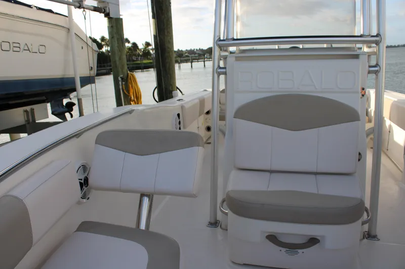 Slide: The Image of 2017 Robalo R200 Center Console boat interior with cushioned seating and console. - 26