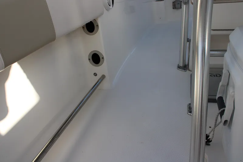 Slide: The Image of Interior view of a 2017 Robalo R200 Center Console boat, featuring stainless steel railings. - 28