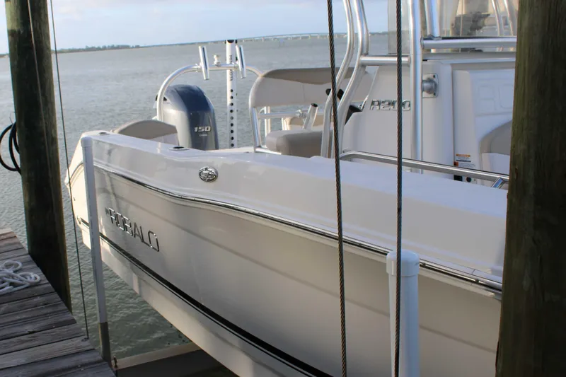 Slide: The Image of 2017 Robalo R200 Center Console boat docked by the water. - 36