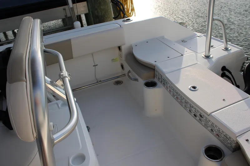Slide: The Image of 2017 Robalo R200 Center Console boat interior with seating and storage compartments. - 5