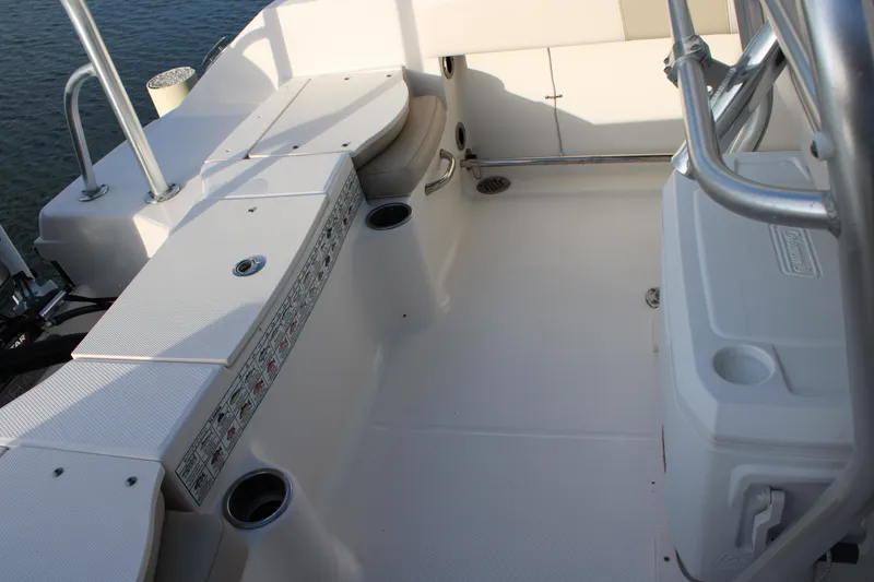 Slide: The Image of 2017 Robalo R200 Center Console boat interior with seating and storage compartments. - 6