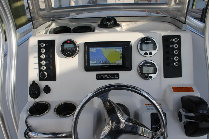 Slide: The Image of 2017 Robalo R200 Center Console dashboard with navigation and control instruments. - 8