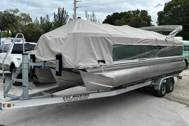 Slide: The Image of 2023 Tahoe Pontoon GT 2385 RF on trailer, blue sky. - 1