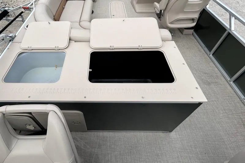Slide: The Image of 2023 Tahoe Pontoon GT 2385 RF on display in a parking lot. - 15