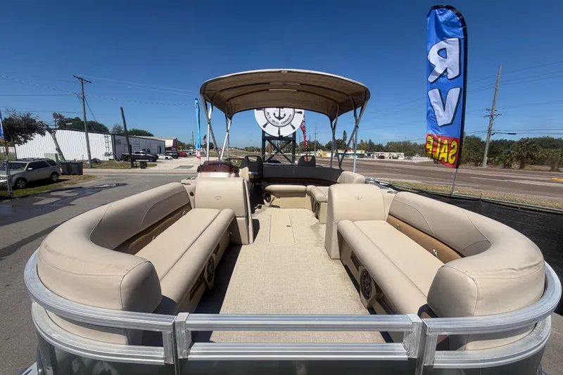 Slide: The Image of 2023 Tahoe Pontoon GT 2385 RF with beige seating and canopy. - 19