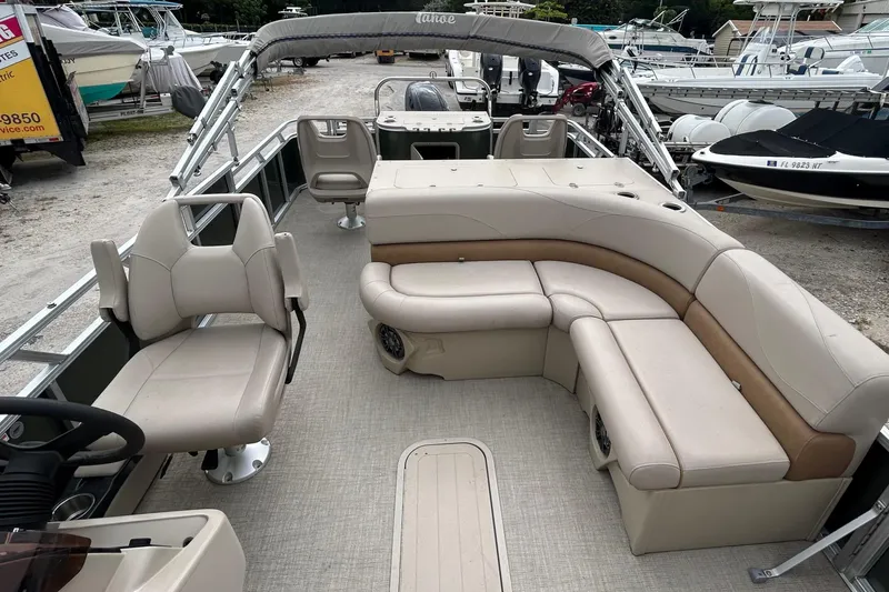 Slide: The Image of 2023 Tahoe Pontoon GT 2385 RF with Suzuki motor on trailer. - 2