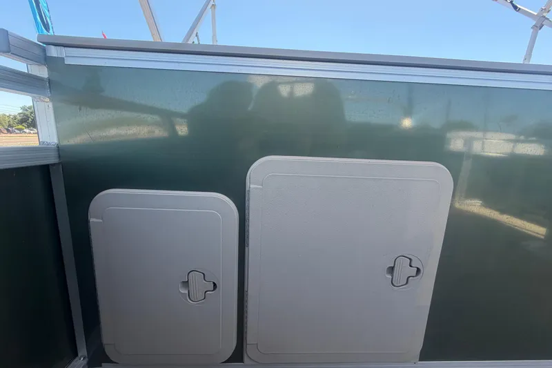 Slide: The Image of 2023 Tahoe Pontoon GT 2385 RF side view with storage hatches. - 28