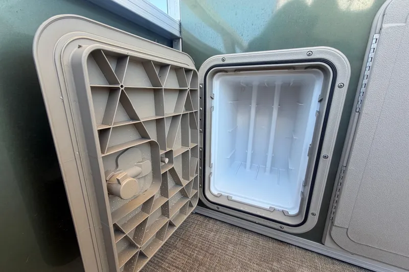 Slide: The Image of Open storage compartment in 2023 Tahoe Pontoon GT 2385 RF. - 29