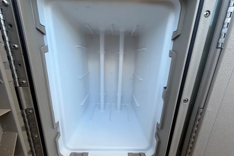 Slide: The Image of Interior of a refrigerator on a 2023 Tahoe Pontoon GT 2385 RF. - 30