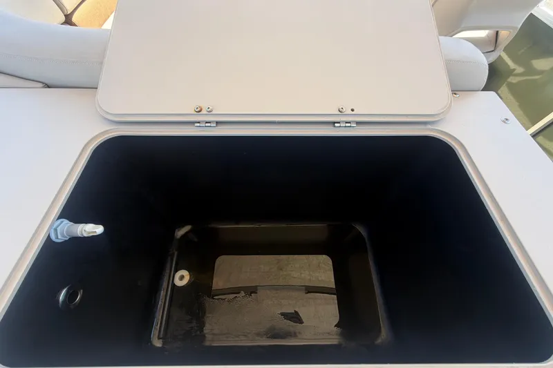 Slide: The Image of Open storage compartment on a 2023 Tahoe Pontoon GT 2385 RF boat. - 37