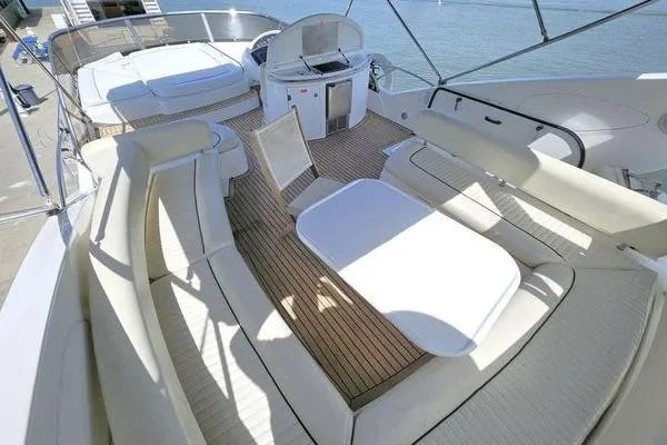 Slide: The Image of Luxurious Sunseeker Manhattan 66 yacht deck with seating and dining area, 2005 model. - 11