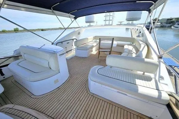 Slide: The Image of Luxurious 2005 Sunseeker Manhattan 66 yacht with spacious deck seating and elegant design. - 12