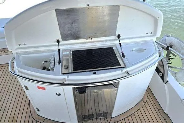 Slide: The Image of Outdoor kitchen on 2005 Sunseeker Manhattan 66 yacht with grill and sink. - 15