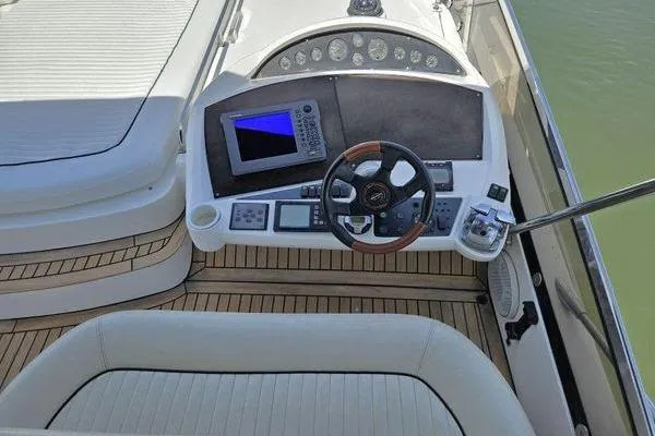 Slide: The Image of Cockpit of 2005 Sunseeker Manhattan 66 yacht with modern navigation equipment. - 16