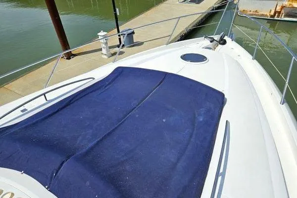 Slide: The Image of Bow view of 2005 Sunseeker Manhattan 66 yacht docked at marina. - 18