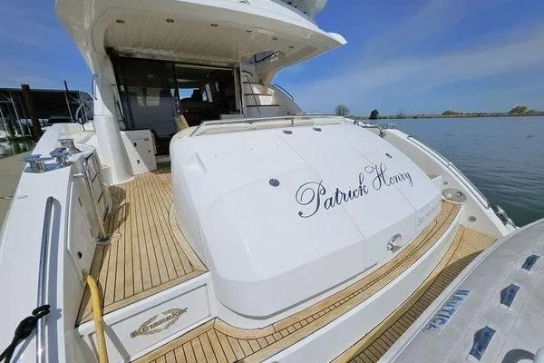 Slide: The Image of Luxury Sunseeker Manhattan 66 yacht, 2005 model, docked with elegant teak decking. - 2