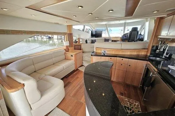 Slide: The Image of Luxurious interior of a 2005 Sunseeker Manhattan 66 yacht with elegant seating and modern amenities. - 22