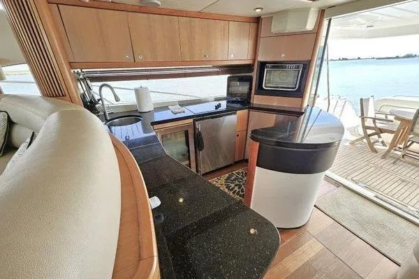 Slide: The Image of Luxurious kitchen interior of 2005 Sunseeker Manhattan 66 yacht with ocean view. - 25