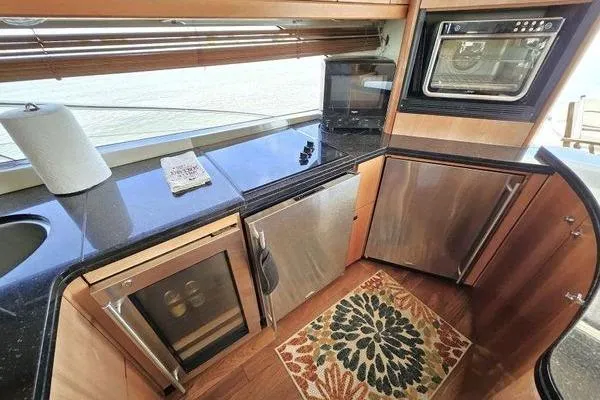 Slide: The Image of Luxurious kitchen interior of 2005 Sunseeker Manhattan 66 yacht with modern appliances. - 26