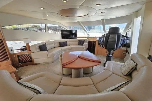 Slide: The Image of Luxurious interior of 2005 Sunseeker Manhattan 66 yacht with plush seating and helm station. - 28