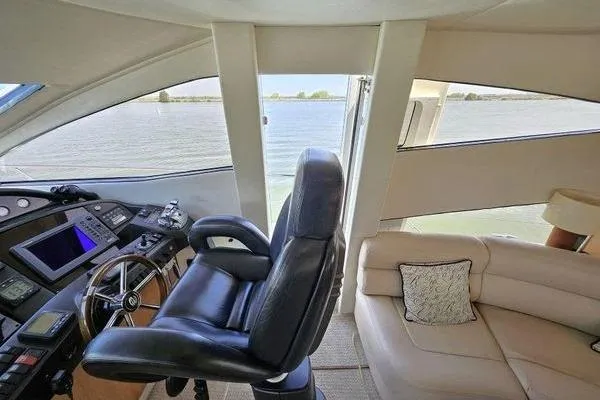 Slide: The Image of Interior view of 2005 Sunseeker Manhattan 66 yacht with helm and seating area. - 29