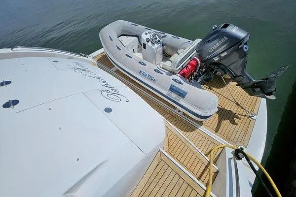 Slide: The Image of Sunseeker Manhattan 66 yacht with inflatable boat and Yamaha motor on deck, 2005 model. - 3