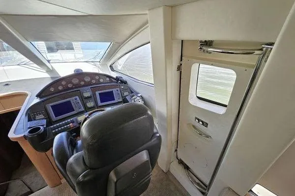 Slide: The Image of Interior helm of 2005 Sunseeker Manhattan 66 yacht with navigation controls. - 30