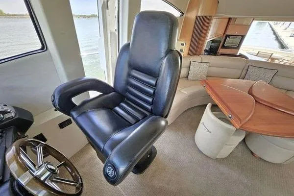 Slide: The Image of Luxurious interior of 2005 Sunseeker Manhattan 66 yacht with leather captain's chair. - 32