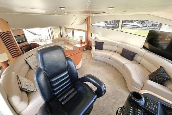 Slide: The Image of Luxurious interior of a 2005 Sunseeker Manhattan 66 yacht with plush seating and helm chair. - 33