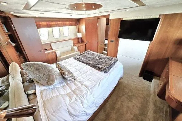Slide: The Image of Luxurious bedroom interior of 2005 Sunseeker Manhattan 66 yacht with elegant furnishings. - 39