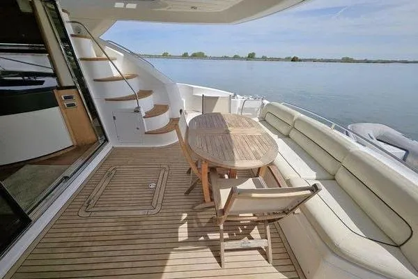 Slide: The Image of Luxury Sunseeker Manhattan 66 yacht deck with seating and table, 2005 model. - 4