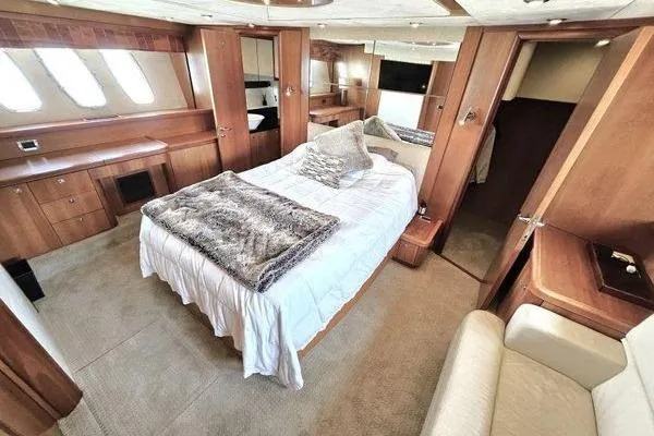 Slide: The Image of Luxurious cabin interior of 2005 Sunseeker Manhattan 66 yacht with elegant wood finishes. - 40