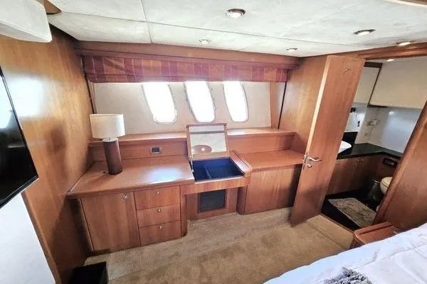 Slide: The Image of Luxurious interior of 2005 Sunseeker Manhattan 66 yacht with wooden cabinetry and natural light. - 42
