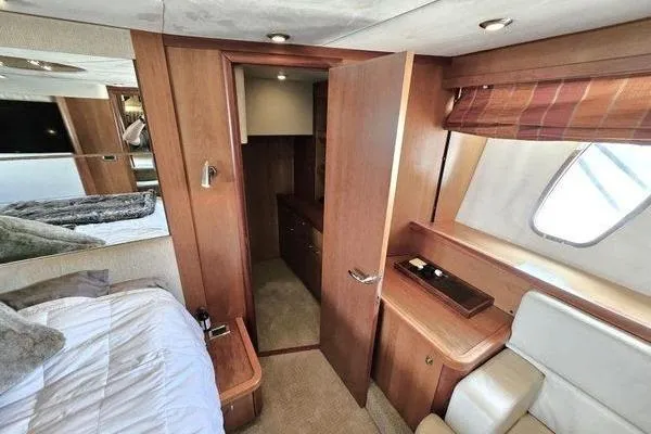 Slide: The Image of Luxurious interior of 2005 Sunseeker Manhattan 66 yacht cabin with wood finishes. - 43