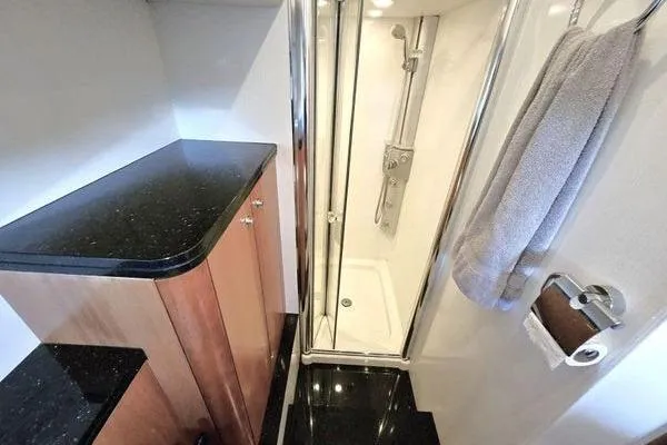 Slide: The Image of Luxurious bathroom in 2005 Sunseeker Manhattan 66 yacht with sleek shower and elegant cabinetry. - 47