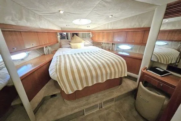 Slide: The Image of Luxurious cabin interior of 2005 Sunseeker Manhattan 66 yacht with cozy bed and elegant decor. - 49