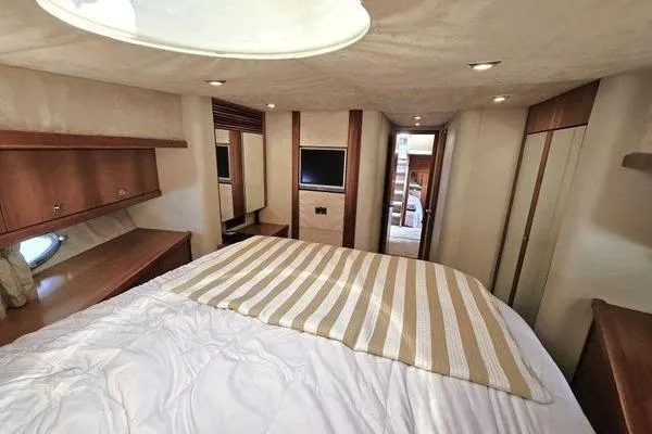 Slide: The Image of Luxurious bedroom interior of 2005 Sunseeker Manhattan 66 yacht with modern amenities. - 51