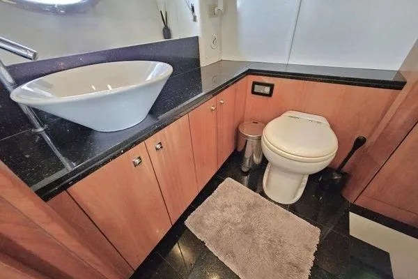 Slide: The Image of Luxurious bathroom in 2005 Sunseeker Manhattan 66 yacht with modern sink and toilet. - 52