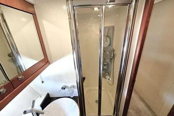 Slide: The Image of Luxurious bathroom with glass shower in 2005 Sunseeker Manhattan 66 yacht. - 53