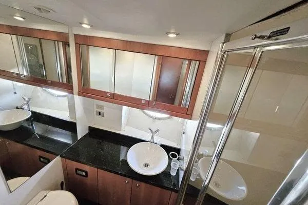 Slide: The Image of Luxurious bathroom in 2005 Sunseeker Manhattan 66 yacht with modern fixtures and elegant design. - 54