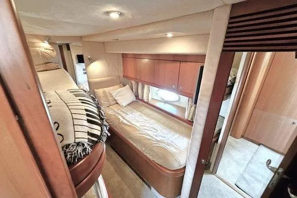 Slide: The Image of Luxurious cabin interior of 2005 Sunseeker Manhattan 66 yacht with cozy bedding. - 57