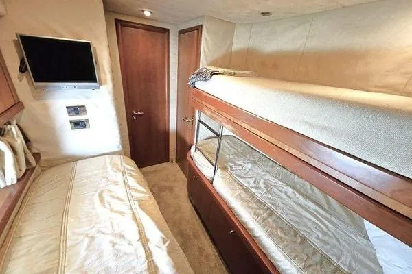 Slide: The Image of Interior cabin of 2005 Sunseeker Manhattan 66 yacht with bunk beds and TV. - 58